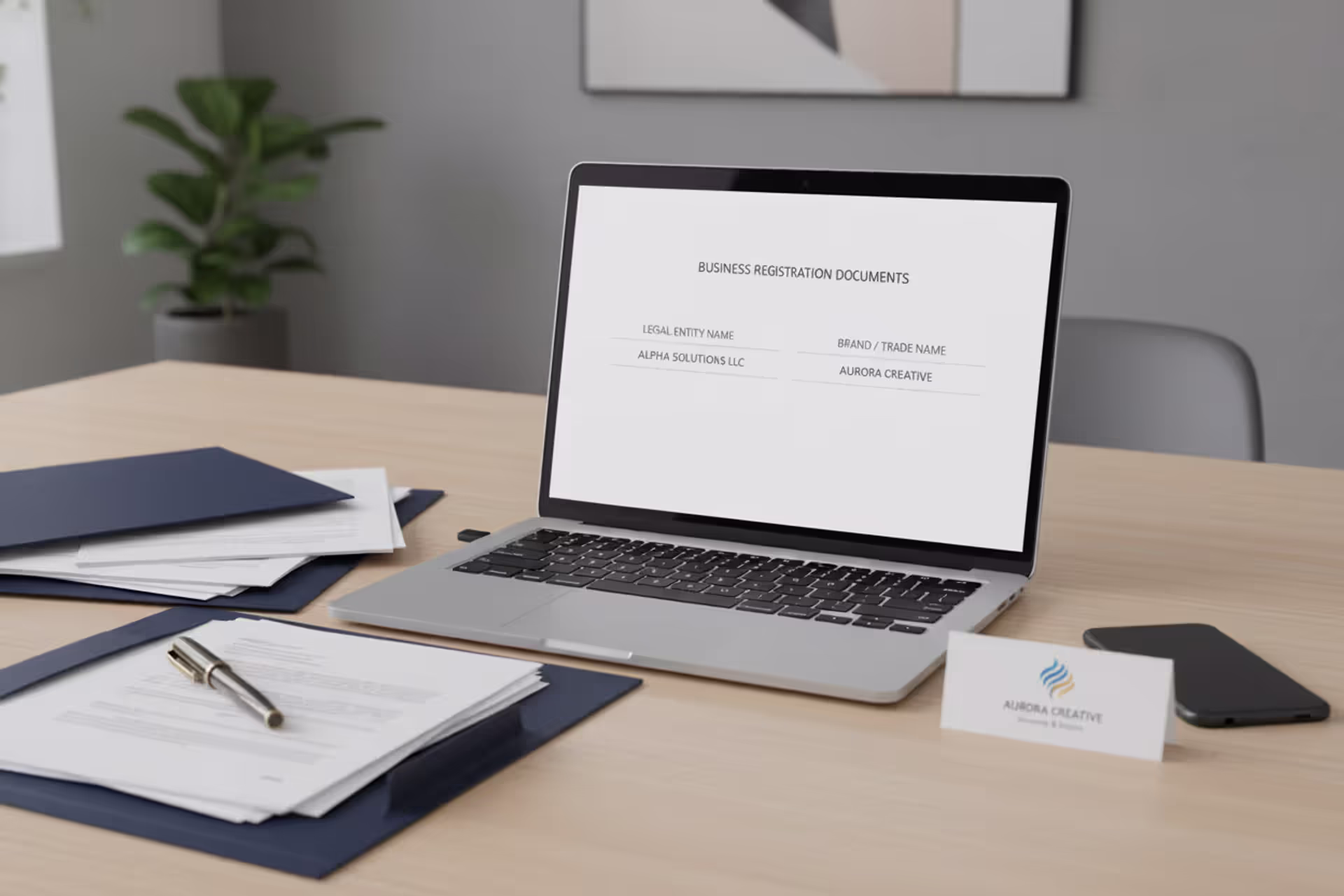 Business owner comparing legal LLC documents and brand identity at office desk