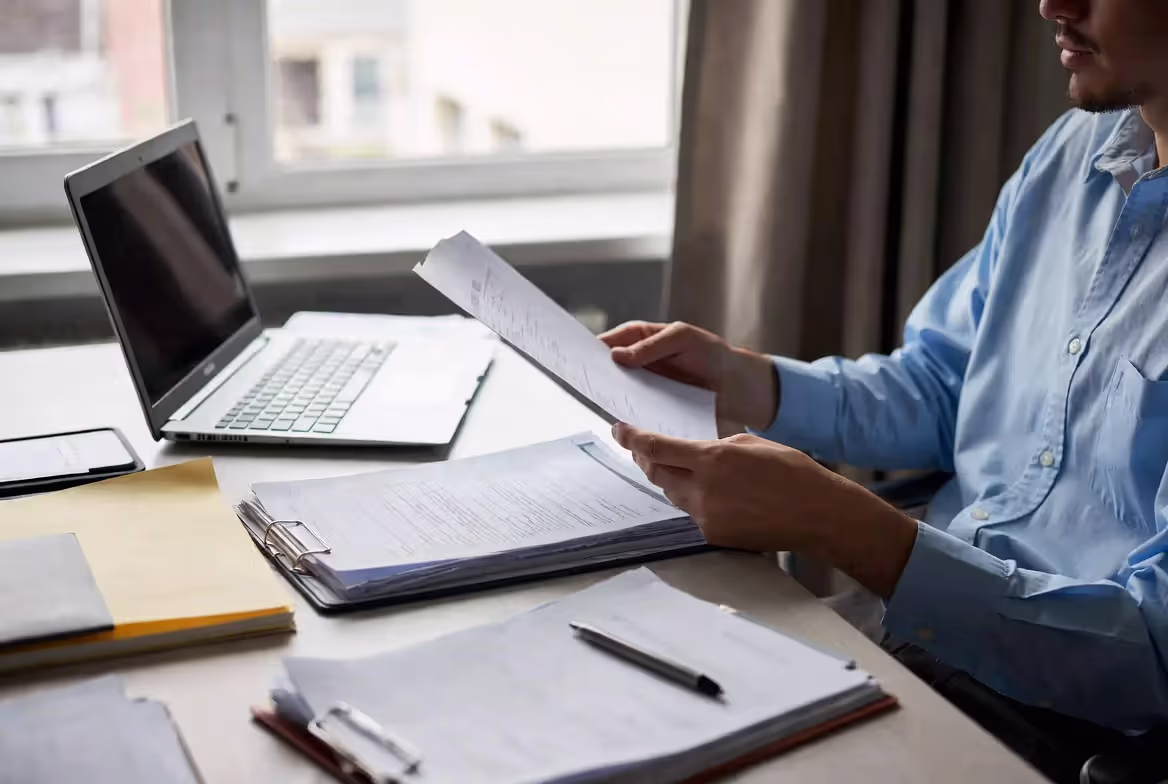 Person checking an LLC application for errors before filing